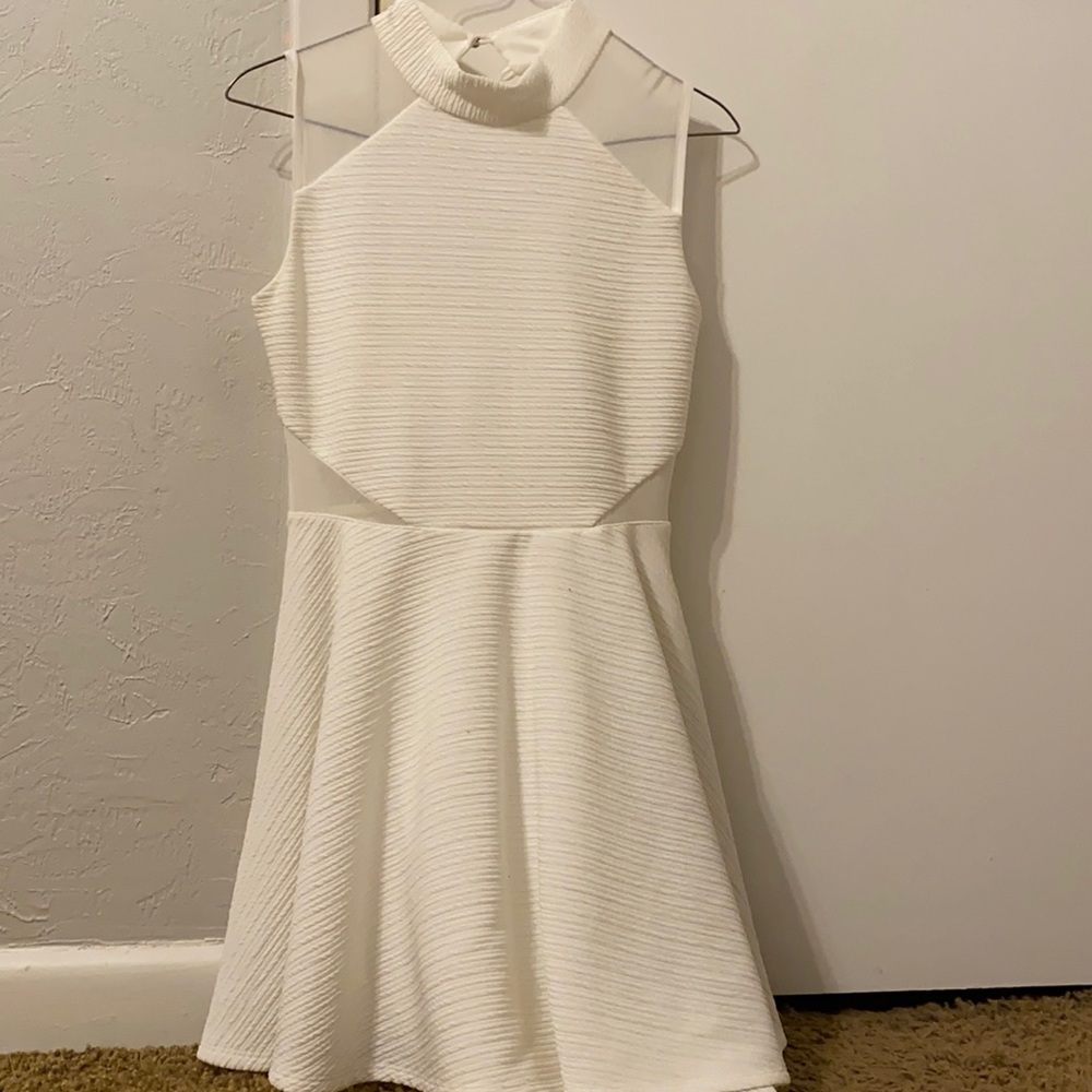 White dress mini. Worn once. Great for someone who is in sorority life.